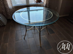Glass top dining table on base 